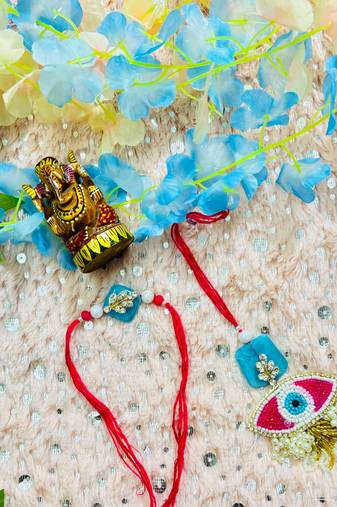 Elegant Evil Eye Bhaiya Bhabhi Rakhi Set with Blue Stone Base & Pearl Tassels