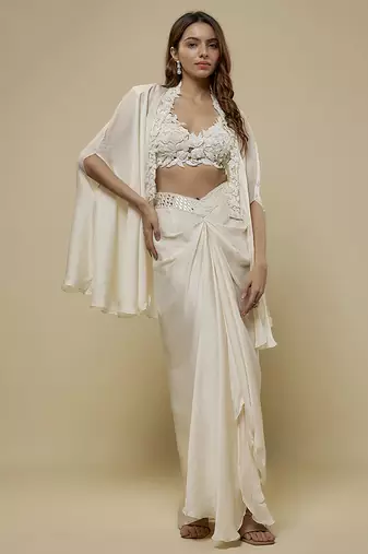 White satin plain cape and skirt paired with emobroidered blouse