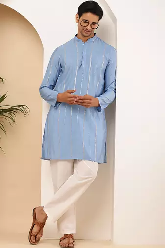 Light blue shiny kurta for men with white pyjama     party & festive wear set