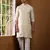 Men beige textured kurta with white pyjama set