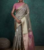 Grey linen blend self woven butta all over, a grand broad patta & sequins woven pallu saree with blouse