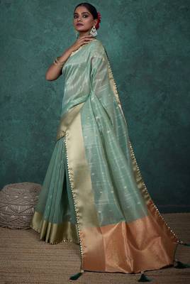 Light green linen blend self woven butta all over, a grand broad patta & sequins woven pallu saree with blouse 2