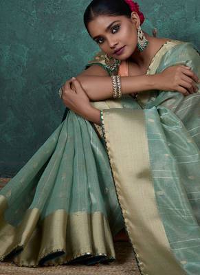 Light green linen blend self woven butta all over, a grand broad patta & sequins woven pallu saree with blouse 3