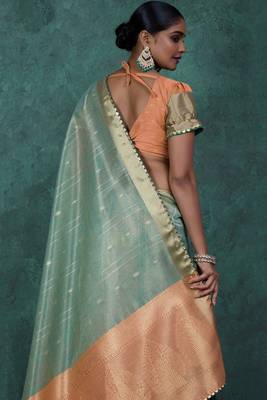Light green linen blend self woven butta all over, a grand broad patta & sequins woven pallu saree with blouse 4