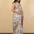 Off white cotton silk abstract print golden zari border saree with unstitched blouse piece