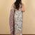Off white cotton silk abstract print golden zari border saree with unstitched blouse piece