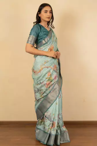 Light sea green cotton silk blend floral print zari woven border saree with unstitched blouse piece