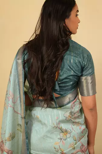 Light sea green cotton silk blend floral print zari woven border saree with unstitched blouse piece