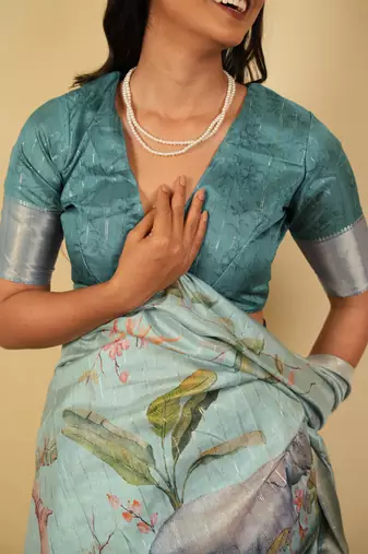 Light sea green cotton silk blend floral print zari woven border saree with unstitched blouse piece