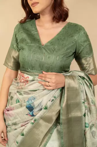 Light olive green cotton silk blend floral print zari woven border saree with unstitched blouse piece