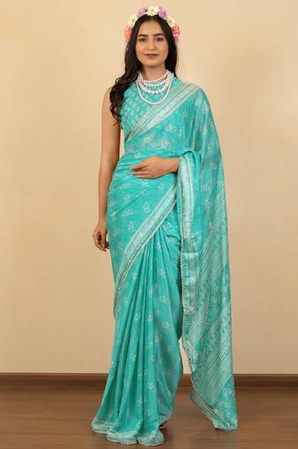 Light turquoise chiffon floral print zari work golden lace saree with unstitched blouse piece