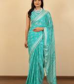 Light turquoise chiffon floral print zari work golden lace saree with unstitched blouse piece