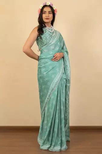 Dusty teal chiffon floral print zari work golden lace saree with unstitched blouse piece