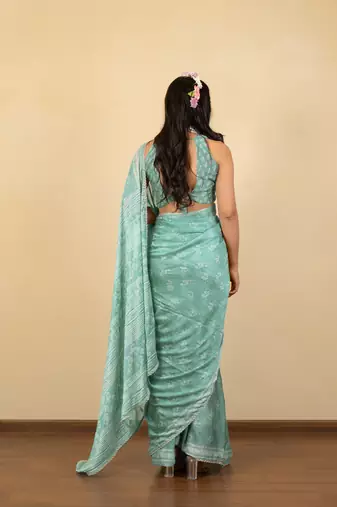 Dusty teal chiffon floral print zari work golden lace saree with unstitched blouse piece