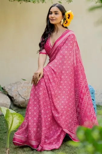 Bright pink chiffon bandhani checks print lace border saree with unstitched blouse piece