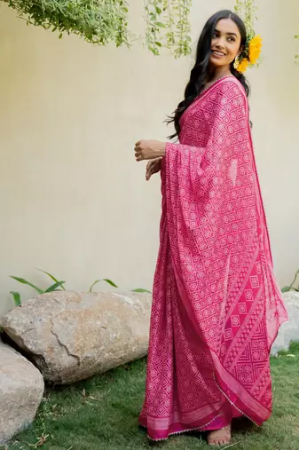 Bright pink chiffon bandhani checks print lace border saree with unstitched blouse piece