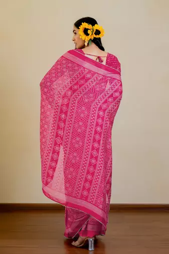 Bright pink chiffon bandhani checks print lace border saree with unstitched blouse piece