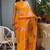 Bright orange chiffon floral print golden zari line border saree with unstitched blouse piece