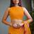 Bright orange chiffon floral print golden zari line border saree with unstitched blouse piece