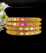 Elegant kundan & ruby gold bangles set