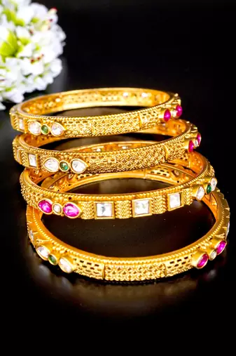 Elegant kundan & ruby gold bangles set