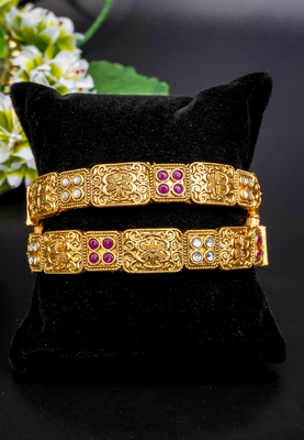 Regal elephant motif gold bangles with enamel detailing 1
