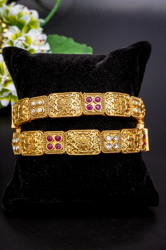 Regal elephant motif gold bangles with enamel detailing