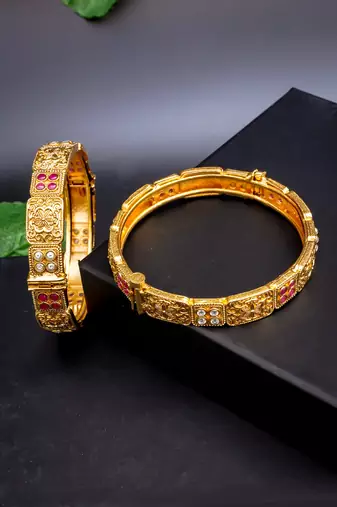Regal elephant motif gold bangles with enamel detailing