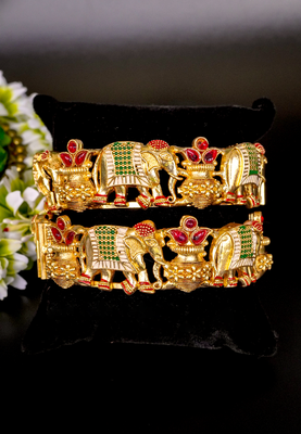Regal elephant motif gold bangles with enamel detailing 1