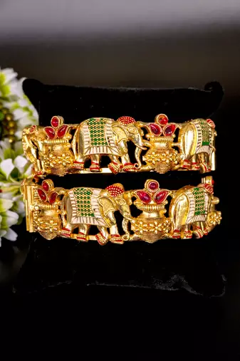 Regal elephant motif gold bangles with enamel detailing
