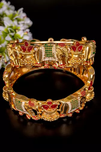 Regal elephant motif gold bangles with enamel detailing