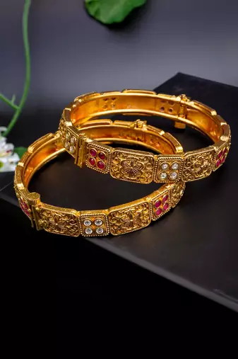 Regal elephant motif gold bangles with enamel detailing