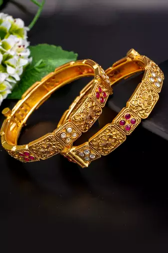 Regal elephant motif gold bangles with enamel detailing