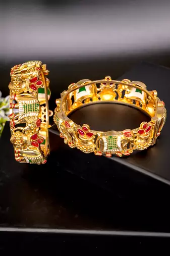 Regal elephant motif gold bangles with enamel detailing