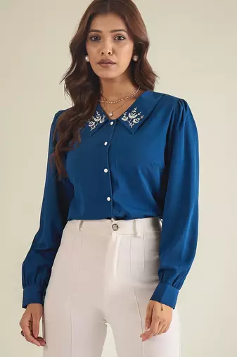 Blue collared shirt with contrast embriodery