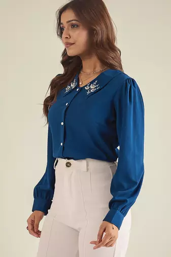 Blue collared shirt with contrast embriodery