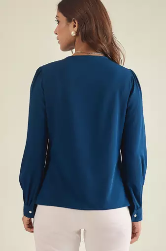 Blue collared shirt with contrast embriodery