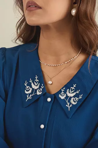 Blue collared shirt with contrast embriodery