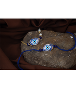 Handcrafted combo of couple pair evil eye protection rakhi for bhaiya bhabhi with roli chawal and written greeting note.