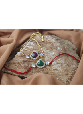 Set of 2 kundan and enamel rakhi and bracelet set for bhaiya bhabhi with roli chawal and written greeting note. 1