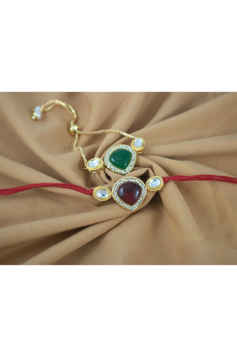Combo of kundan rakhi and bracelet set for bhaiya bhabhi with roli chawal and written greeting note.
