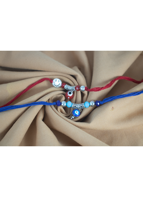 Combo of evil eye and smiley charm unisex rakhi for bhaiya bhabhi with roli chawal and written greeting note. 2