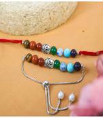 Healing 7 chakra beads and buddha charm unisex rakhi set for bhaiya bhabhi with roli chawal and written greeting note.