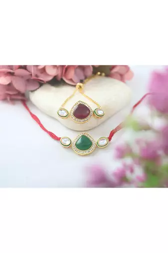 Set of 2 kundan and enamel rakhi and bracelet set for bhaiya bhabhi with roli chawal and written greeting note.