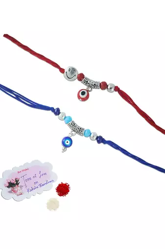 Combo of evil eye and smiley charm unisex rakhi for bhaiya bhabhi with roli chawal and written greeting note.