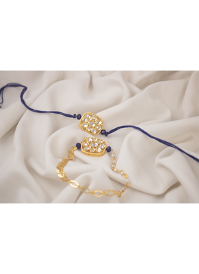 Combo of latest gold plated kundan rakhi for bhaiya bhabhi with roli chawal and written greeting note (blue). 1
