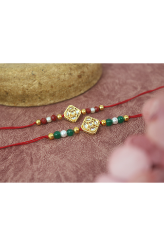 Traditional kundan with pearl and beads rakhi set for bhaiya with roli chawal and written greeting note.