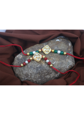 Traditional kundan with pearl and beads rakhi set for bhaiya with roli chawal and written greeting note. 2
