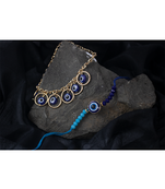 combo of fancy evil eye handcrafted protection  rakhi for bhaiya bhabhi with roli chawal and written greeting note.