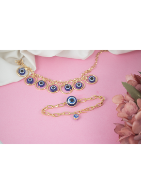 Stylish gold plated combo of evil eye protective rakhi for bhaiya bhabhi with roli chawal and written greeting note. 1